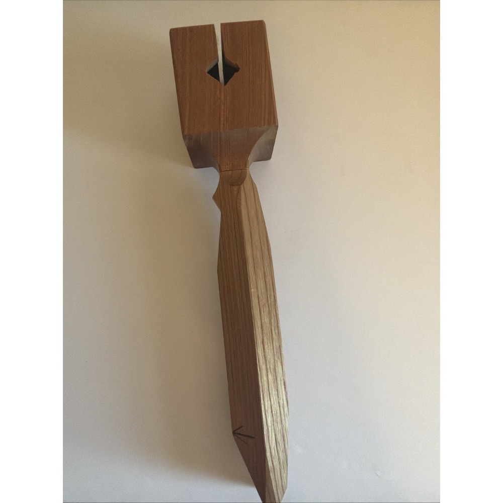 Japanese Handcrafted wooden mallet with carved handle and diamond cutout head.